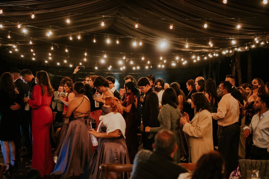 Wedding guests dancing and celebrating at a reception