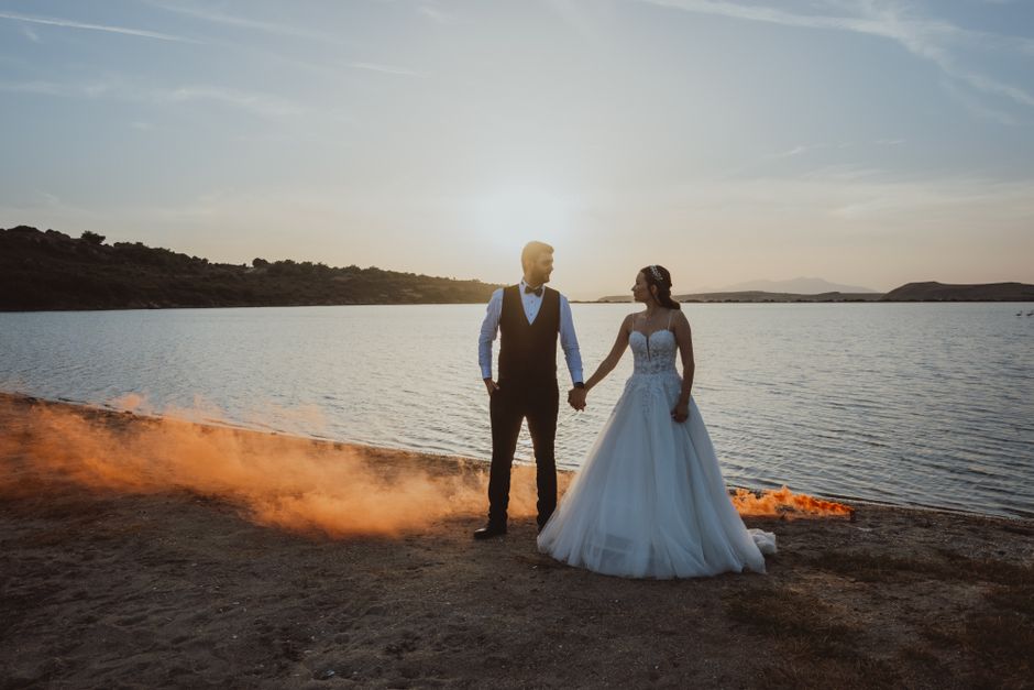 A couple embracing at sunset on their wedding day